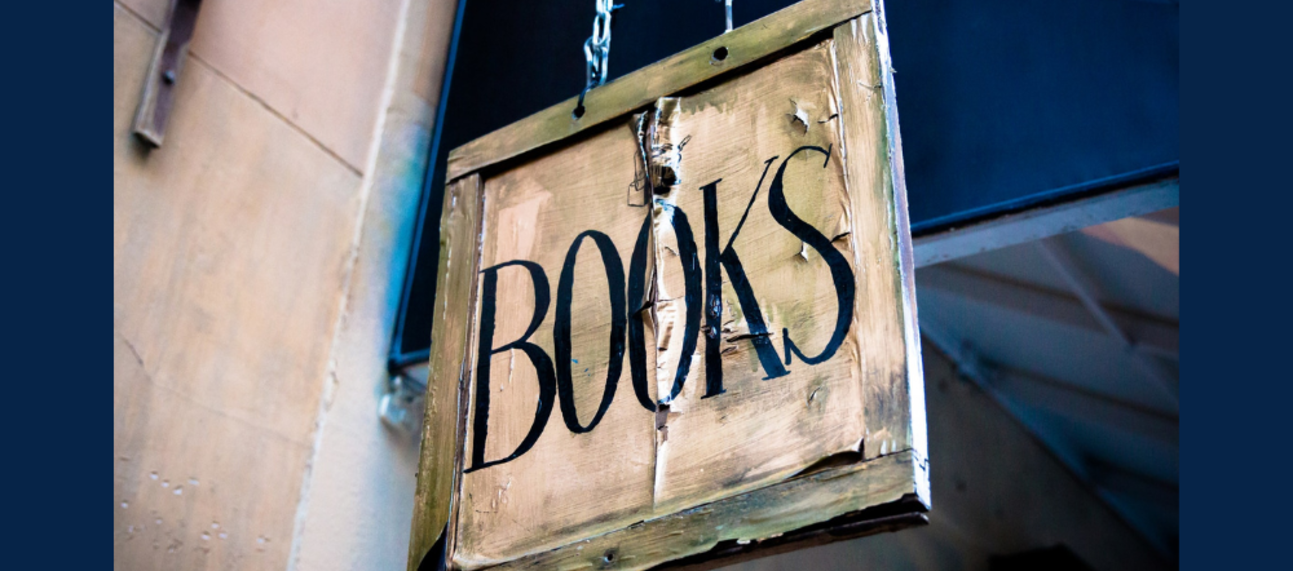 Tattered book shop sign 