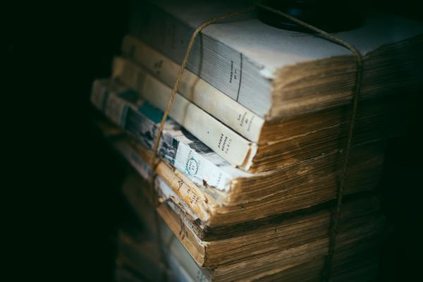 pile of old books tied by string