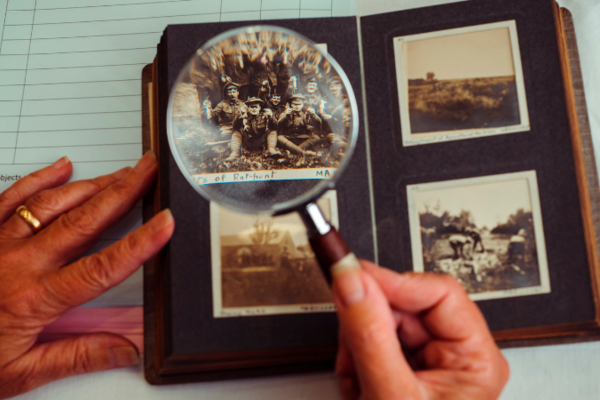 photo album with magnifying glass highlighting photo