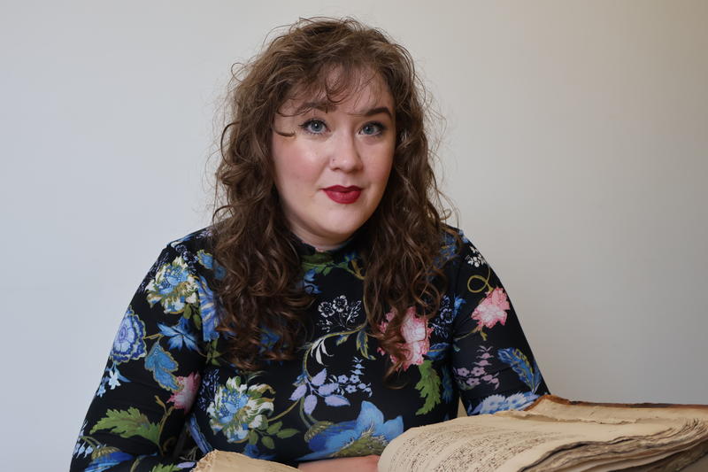 leah veronese with the manuscript featuring Shakespeare's sonnet