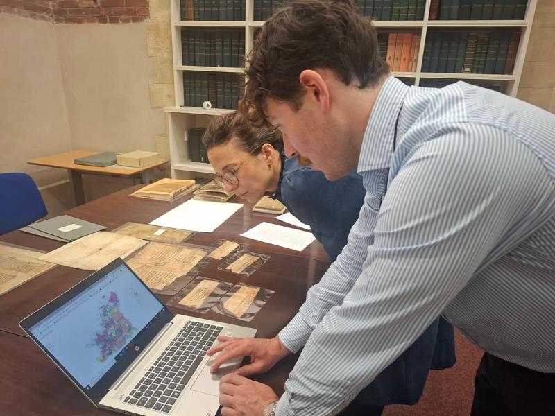 tamara atkin and callum tostevin hall examine manuscript fragments