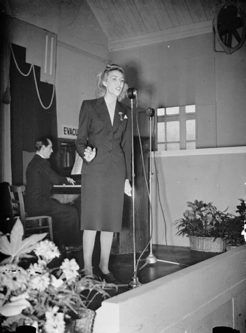 Vera Lynn singing at a munitions factory UK 1941 