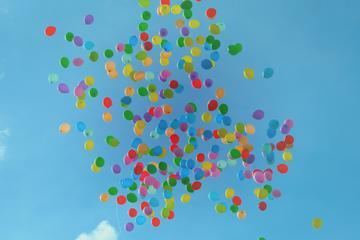 balloons floating into the sky