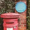 Letter box outside Murray's home with blue plaque