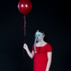 contagion cabaret woman in red dress with gas mask and balloon