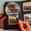 photo album with magnifying glass highlighting photo